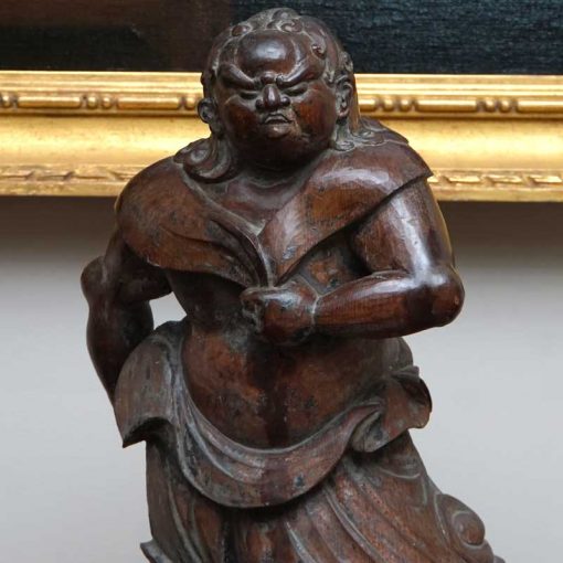 Acala deity carved figure