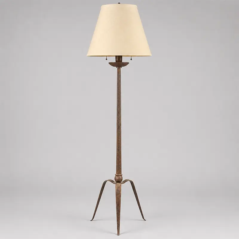 Hand-forged wrought iron tripod floor lamp with rustic modern design and sculptural tapered legs, mid-20th century.