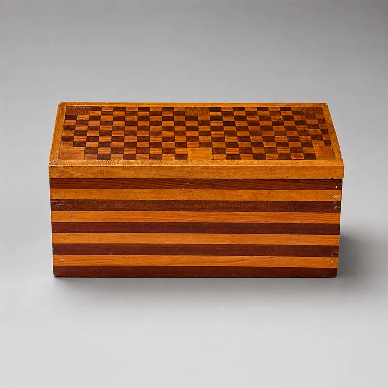 olk Art wooden box with striped sides and geometric checkerboard wood mosaic lid.