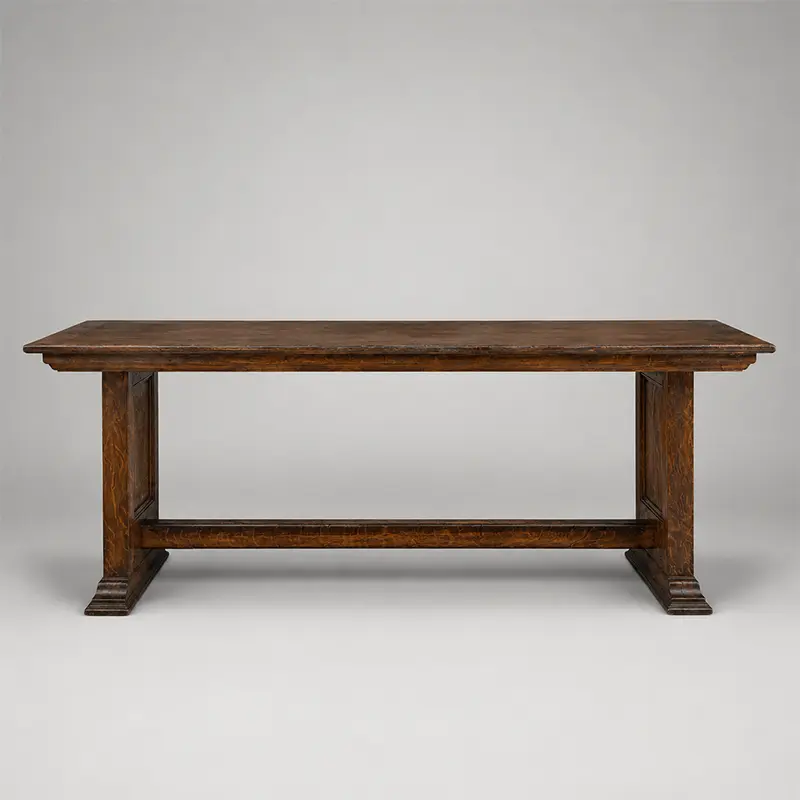 English or Continental oak console table with trestle supports, paneled ends, molded feet, and long horizontal stretcher.
